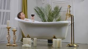 Woman Relaxing In Bubble Bath Stock