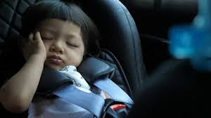 Baby Sleeping In Car Seat Stock