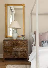 Gold Mirror Over Light Gray Nightstand