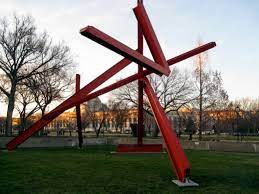 red sculpture by mark di suvero makes