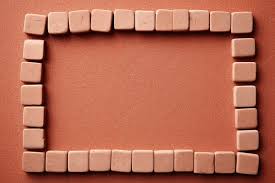 Small Bricks Forming A Square On Cork
