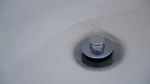 Water Runs Into A Bathtub Drain