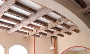 installing wood beams on a ceiling