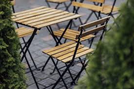 A Purple Colored Metal Patio Table Near