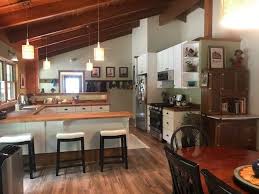 u shaped kitchen with exposed beams