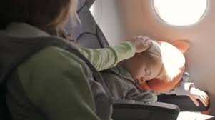 Child Sleeping On Seat Traveling By
