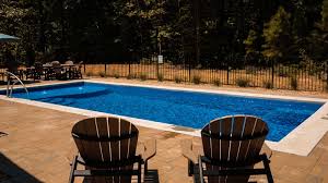 An Inground Pool In A Small Backyard