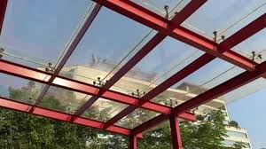 A Glass Roof On Top Of A Garden Beside