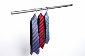 Business Tie Hanging Neatly On A Coat Rack