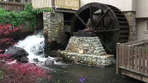 Water Wheel And Waterfall At Mill In