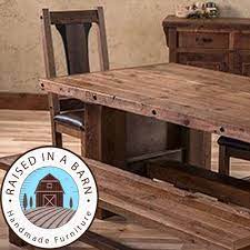 barn wood dining table raised in a