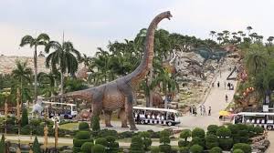 Tropical Garden With Dinosaur Sculpture