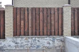 A Wooden Fence Design With Brick