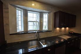 Granite Countertops And Tile Backsplash