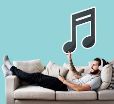 Free Photo Man Holding An Icon On A Couch