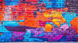 Brick Wall With A Colorful Graffiti