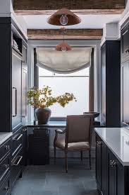 black galley kitchen with rustic wooden