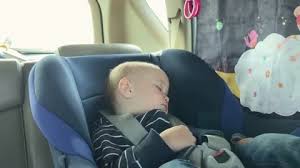 Sleeping Children Fastened Car Seat