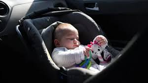 Baby Traveling In Car On Front Seat Of