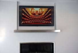 Frame Tv Mounted Above Fireplace