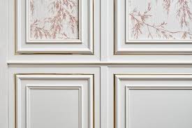 White Wall Panel With Gold Molding