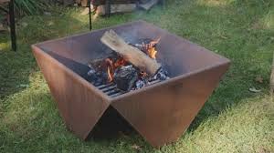 Iron Burning Fire Pit With Logs Stock