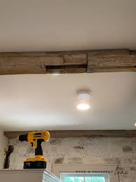 cut down and install reclaimed beams