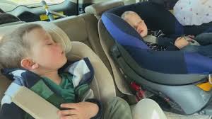 Sleeping Children Fastened Car Seat