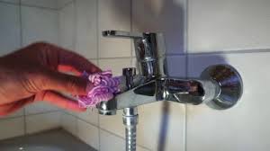 Hand Cleaning Shower Faucet With Rag