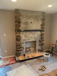 stone fireplace with barn wood mantel