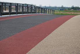 wear layers for roadbed and bridge deck