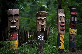 A Group Of Wooden Totem Pole In The