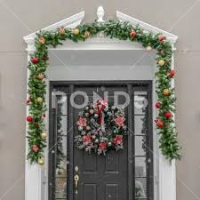 Glass Paned Front Door With Garland And