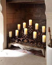 A Fireplace Mantle With Flameless Candles