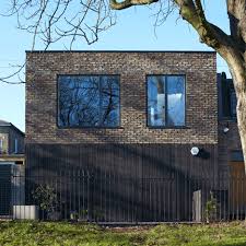 Brick And Charred Wood For London House