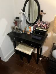 black vanity table with mirror and
