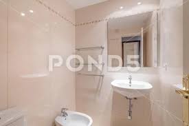 Cozy Small Bathroom With Beige Tiles On