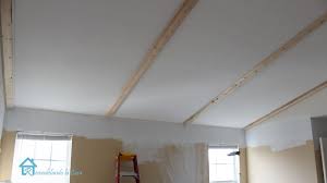 installing faux wooden beams first
