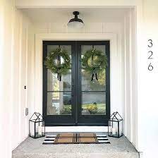 Modern Farmhouse Entry With Metal Door