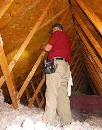 Inspecting Added Blown Insulation In An