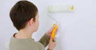 Child Using Paint Roller Stock Footage