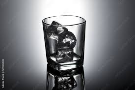 Single Glass With Ice Cubes Stock Photo