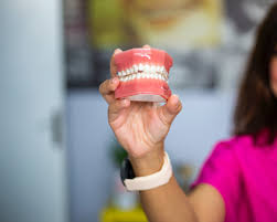 dentures vs dental implants which