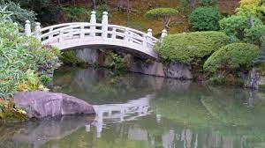 White Arch Bridge Over Pond In Yasuda