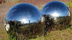 A Reflection In A Two Shiny Steel Ball