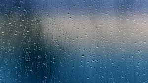 Raindrops Sliding On Window Glass