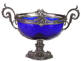 A Cobalt Blue Glass Bowl With Metal