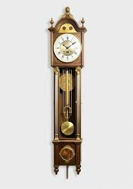 An Antique Pendulum Clock Hanging From