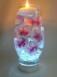 Pink Orchids Float In A 10 Inch Glass
