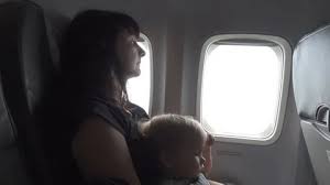 Son Baby Sitting On Mother S Lap In